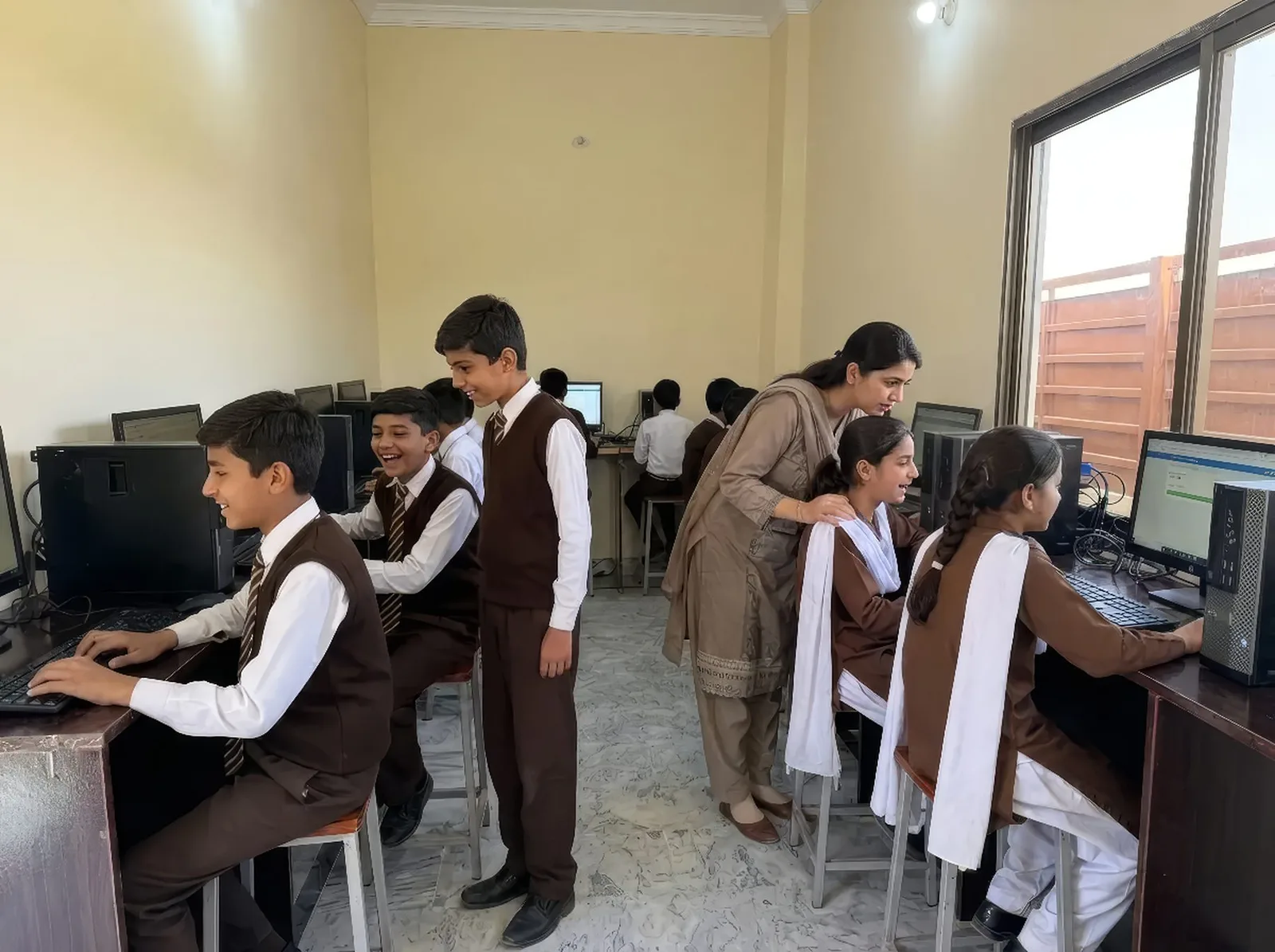 Students in the computer lab with their teacher